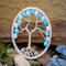 silver wire tree adorned with light sky blue and speckled glass beads